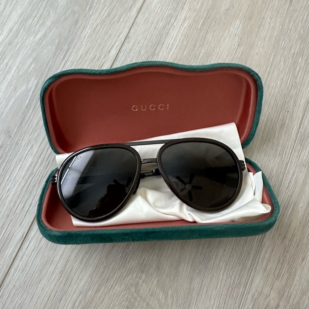Gucci Black Frame Sunglasses with Dark Lenses